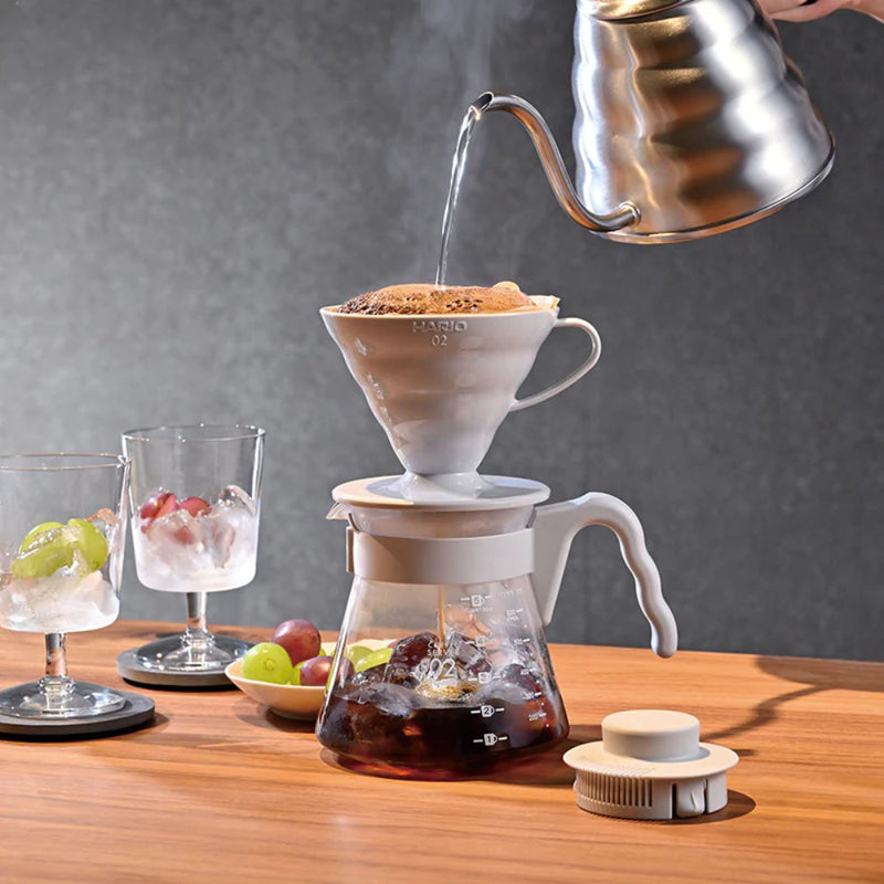 Load image into Gallery viewer, Hario V60 Coffee Server 02 Set Pale Grey putting water into the manual brewer