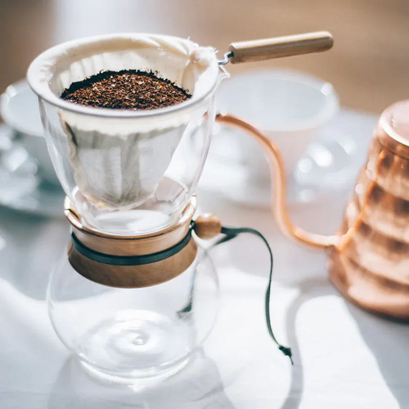 Load image into Gallery viewer, Hario Drip Pot with Olive Woodneck collar and reusable cloth filter for authentic Nel drip coffee brewing.