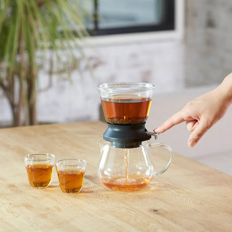 Load image into Gallery viewer, Hario Tea Dripper LARGO 35 set featuring a round glass steeping bowl, silicone base, and matching 800ml glass server.