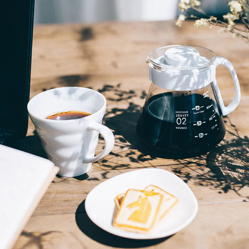Load image into Gallery viewer, White ceramic Hario V60 pour-over set with a size 02 dripper for superior heat retention and a heatproof glass carafe. image 4

