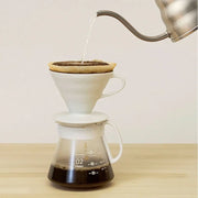 White ceramic Hario V60 pour-over set with a size 02 dripper for superior heat retention and a heatproof glass carafe. image 5