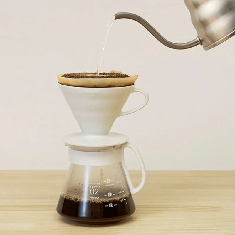 Load image into Gallery viewer, White ceramic Hario V60 pour-over set with a size 02 dripper for superior heat retention and a heatproof glass carafe. image 5
